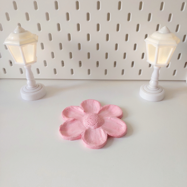 Light pink flower-shaped jewelry holder made of clay