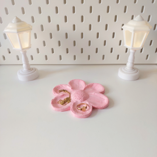 Light pink flower-shaped jewelry holder made of clay