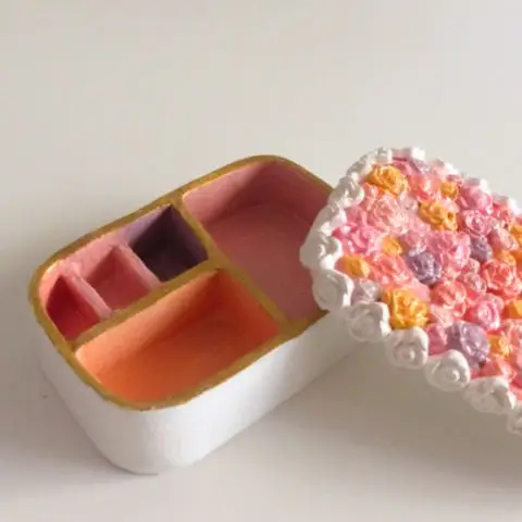 Floral jewelry box styled on vanity table